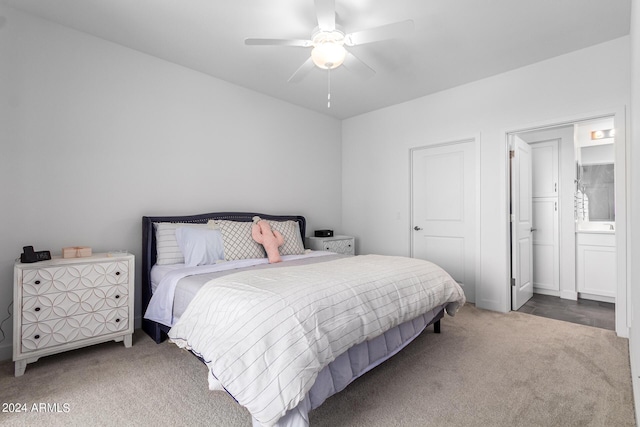 bedroom featuring ensuite bath, ceiling fan, and carpet flooring