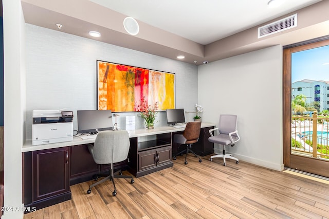 office area with light hardwood / wood-style flooring