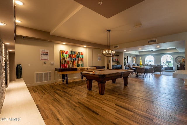 rec room featuring a tray ceiling, billiards, and hardwood / wood-style flooring