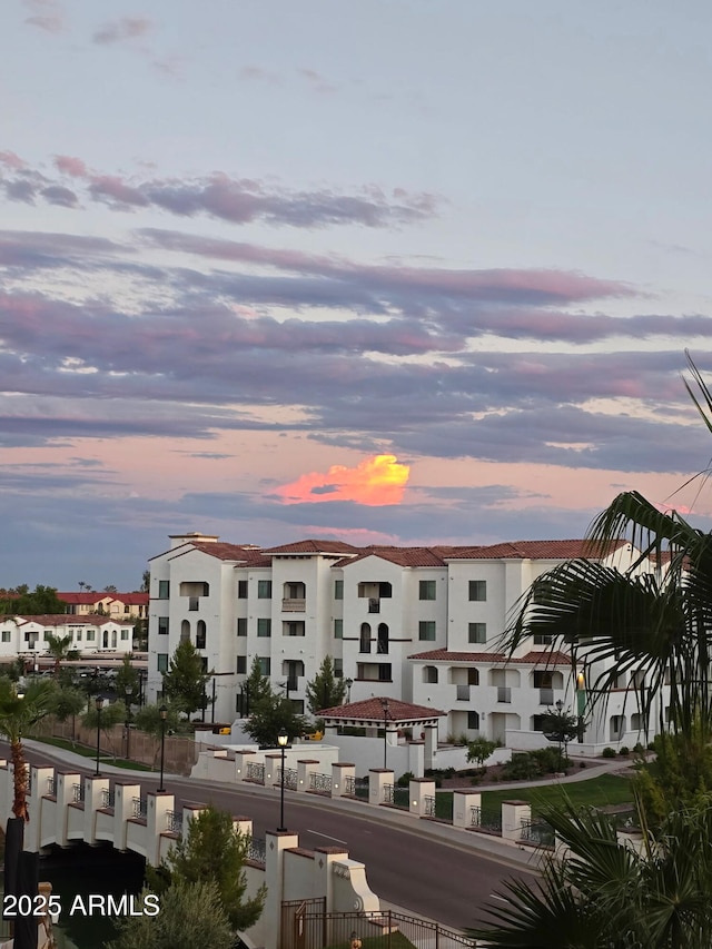 view of outdoor building at dusk