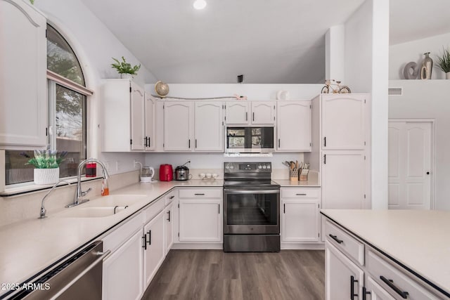 kitchen with visible vents, a sink, light countertops, white cabinets, and appliances with stainless steel finishes