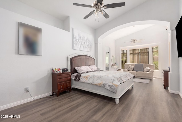 bedroom with arched walkways, baseboards, lofted ceiling, and dark wood-style flooring