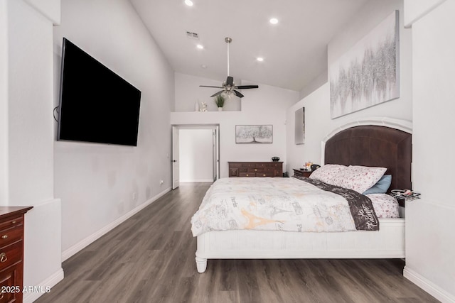 bedroom featuring visible vents, wood finished floors, recessed lighting, baseboards, and vaulted ceiling