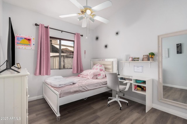 bedroom with ceiling fan, baseboards, wood finished floors, and vaulted ceiling