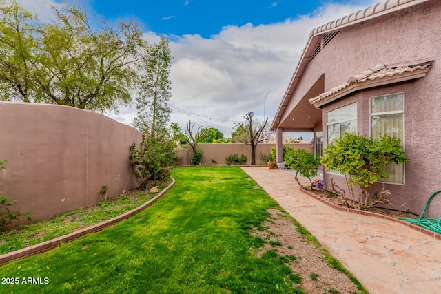 view of yard featuring a fenced backyard