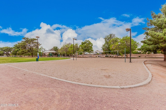 view of home's community featuring volleyball court