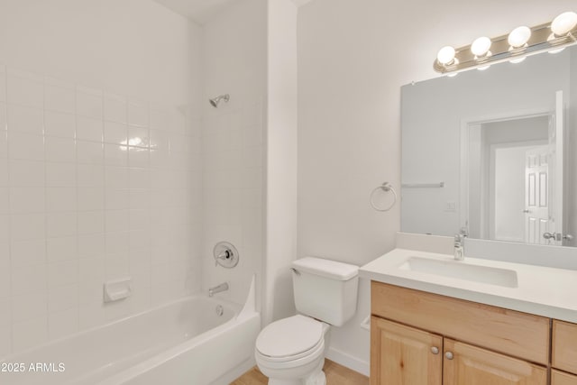 full bathroom featuring vanity, toilet, and tiled shower / bath combo