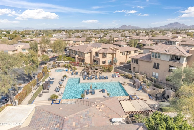 birds eye view of property with a mountain view