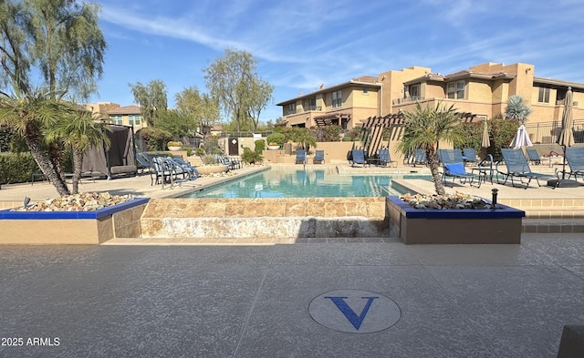 view of pool featuring a patio area