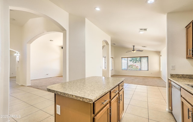 17617 W Corrine Dr, Surprise, AZ 85388 - kitchen featuring light carpet, open floor plan, light tile patterned floors, dishwasher, and lofted ceiling
