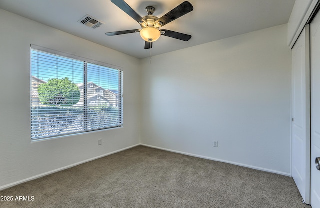 17617 W Corrine Dr, Surprise, AZ 85388 - spare room featuring carpet, baseboards, and a ceiling fan