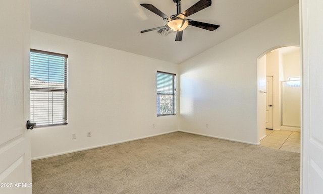 17617 W Corrine Dr, Surprise, AZ 85388 - unfurnished room featuring a ceiling fan, light colored carpet, lofted ceiling, arched walkways, and baseboards