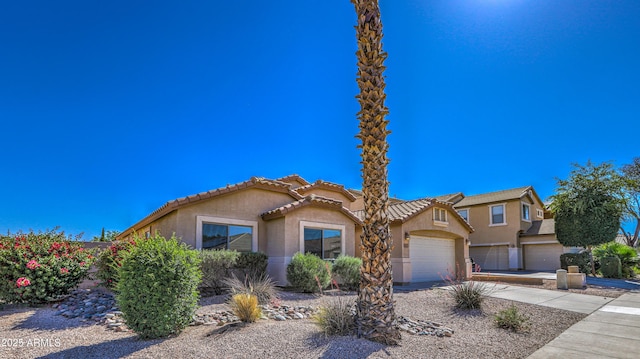 17617 W Corrine Dr, Surprise, AZ 85388 - view of front facade with stucco siding, driveway, a garage, and a tile roof