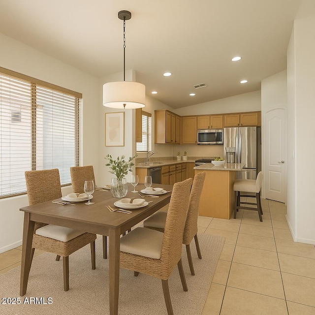 17617 W Corrine Dr, Surprise, AZ 85388 - dining area featuring vaulted ceiling, light tile patterned floors, recessed lighting, and baseboards