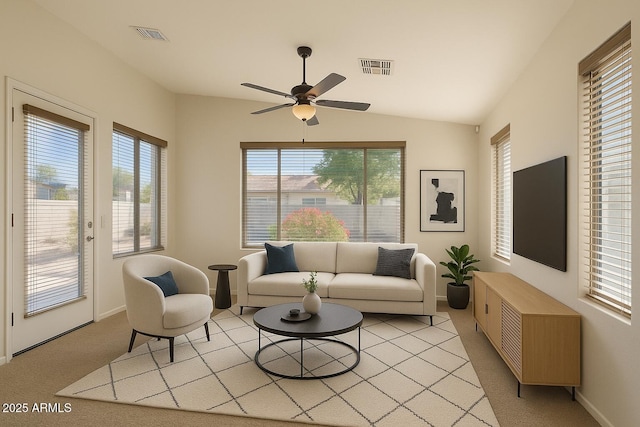 17617 W Corrine Dr, Surprise, AZ 85388 - living room with baseboards, light carpet, ceiling fan, and vaulted ceiling