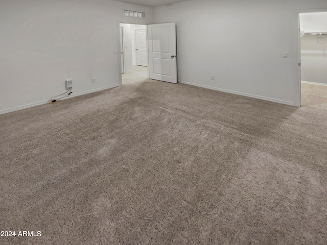 spare room with light carpet