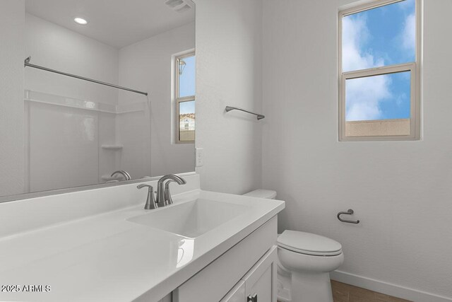 bathroom featuring toilet, recessed lighting, visible vents, vanity, and baseboards