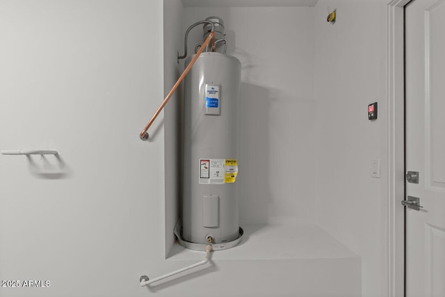 utility room featuring water heater