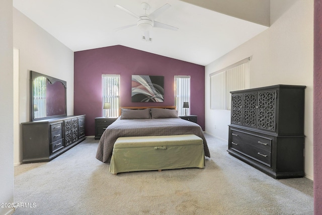 bedroom featuring carpet floors, vaulted ceiling, and ceiling fan