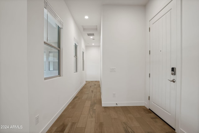 hallway with light wood-type flooring