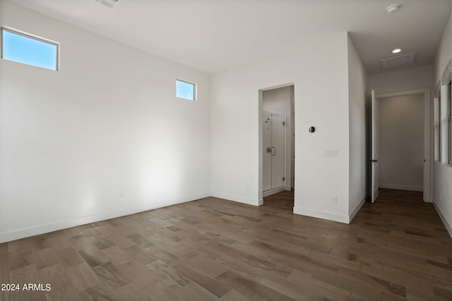 interior space with hardwood / wood-style floors and multiple windows