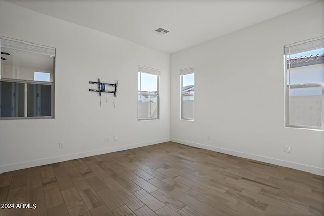 empty room with wood-type flooring