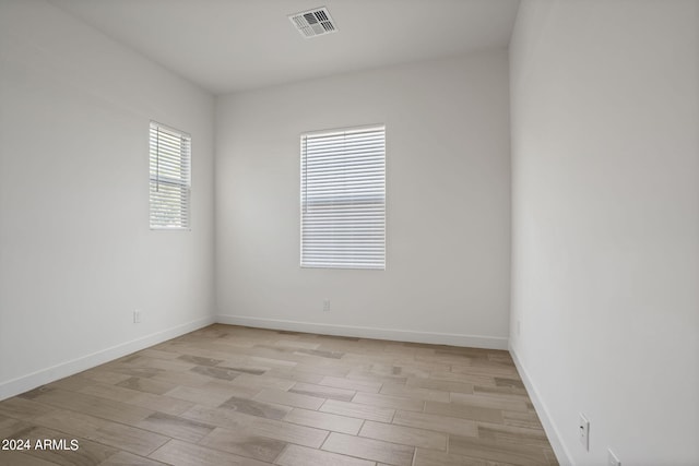 unfurnished room featuring light hardwood / wood-style flooring