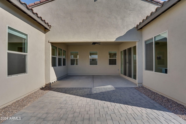 view of patio featuring ceiling fan