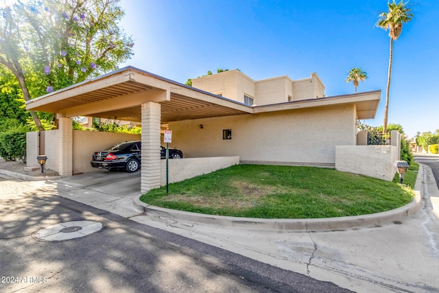 view of front facade with a carport