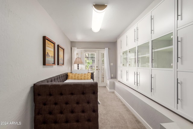 carpeted bedroom with ceiling fan and a closet