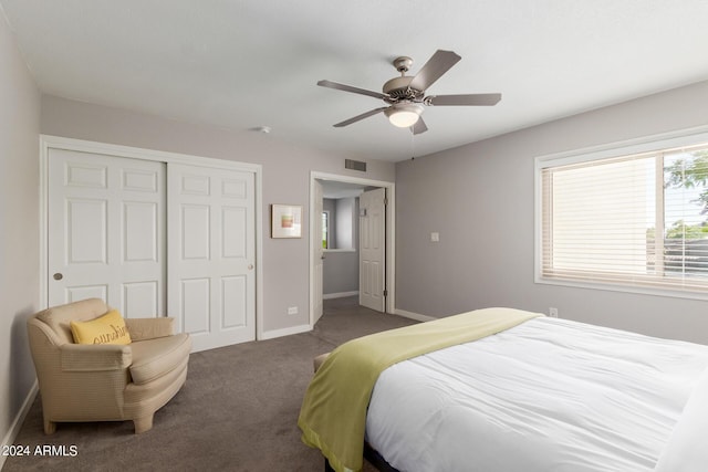 carpeted bedroom featuring a closet and ceiling fan