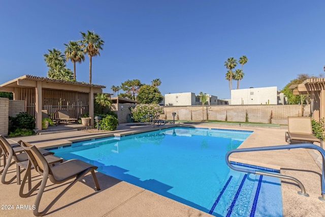 view of swimming pool featuring a patio