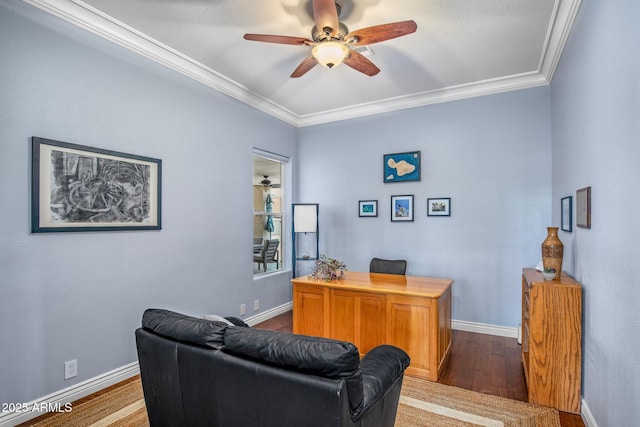 office space featuring baseboards, dark wood-type flooring, ceiling fan, and crown molding