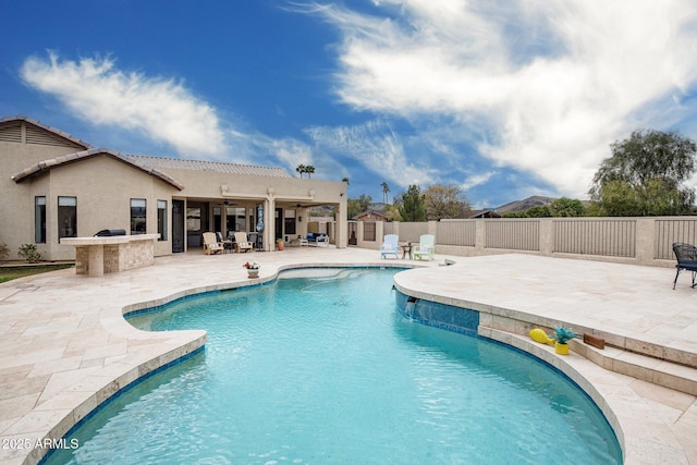 view of pool featuring a ceiling fan, a patio area, a fenced in pool, and a fenced backyard