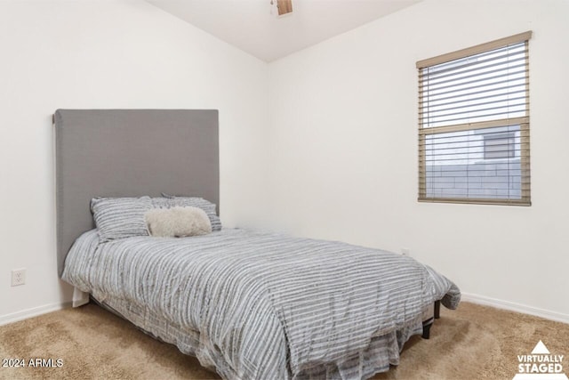 bedroom featuring light colored carpet