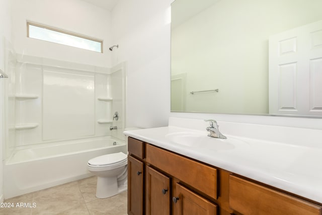 full bathroom with tile patterned floors, toilet, shower / bathtub combination, and vanity