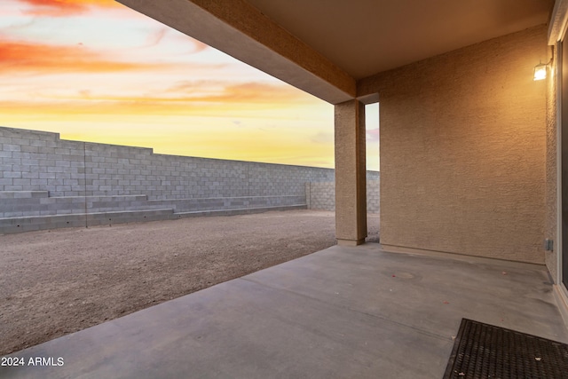 view of patio terrace at dusk