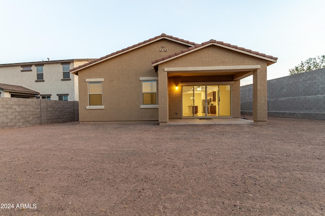 rear view of property with a patio area