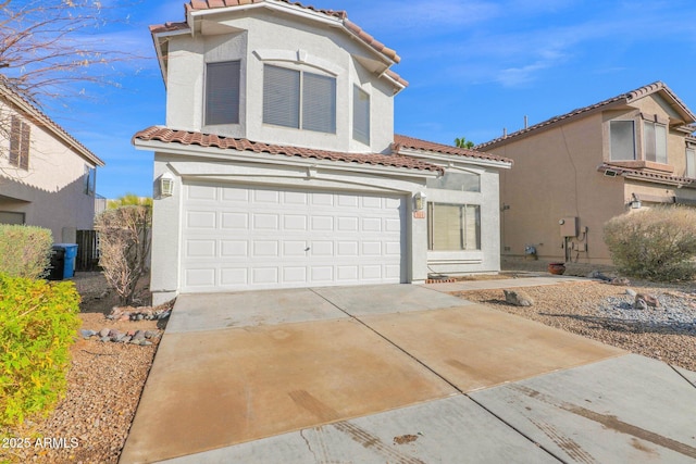 mediterranean / spanish-style house featuring a garage