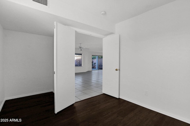 unfurnished room with ceiling fan, lofted ceiling, and hardwood / wood-style floors