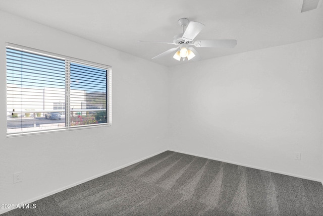 unfurnished room featuring ceiling fan and carpet flooring