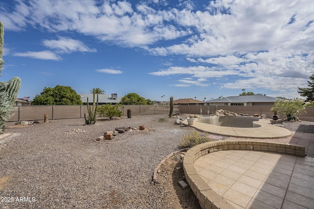 view of yard with a patio area and a fenced backyard