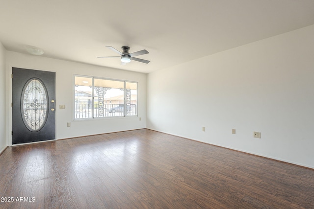 foyer featuring dark wood finished floors, baseboards, and ceiling fan