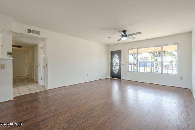 unfurnished living room with ceiling fan, visible vents, and light wood-type flooring