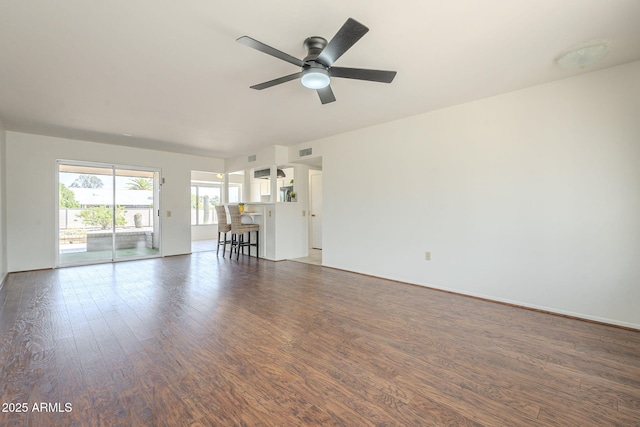 unfurnished living room with visible vents, ceiling fan, and wood finished floors