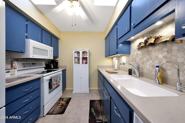 kitchen featuring white appliances, sink, backsplash, and blue cabinets