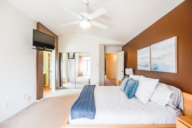 bedroom featuring carpet, a closet, visible vents, a ceiling fan, and vaulted ceiling