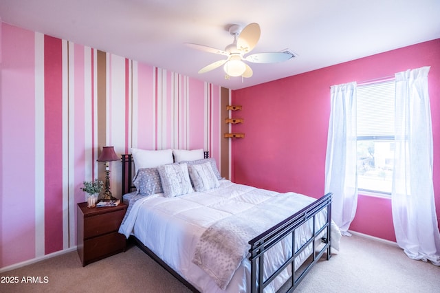 bedroom featuring ceiling fan, carpet, and baseboards