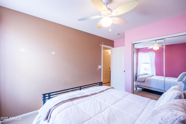 bedroom with ceiling fan, a closet, carpet, and baseboards