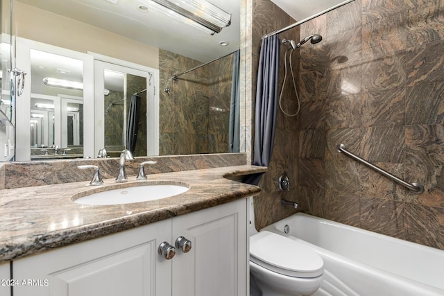 full bathroom with toilet, vanity, and shower / bath combination with curtain